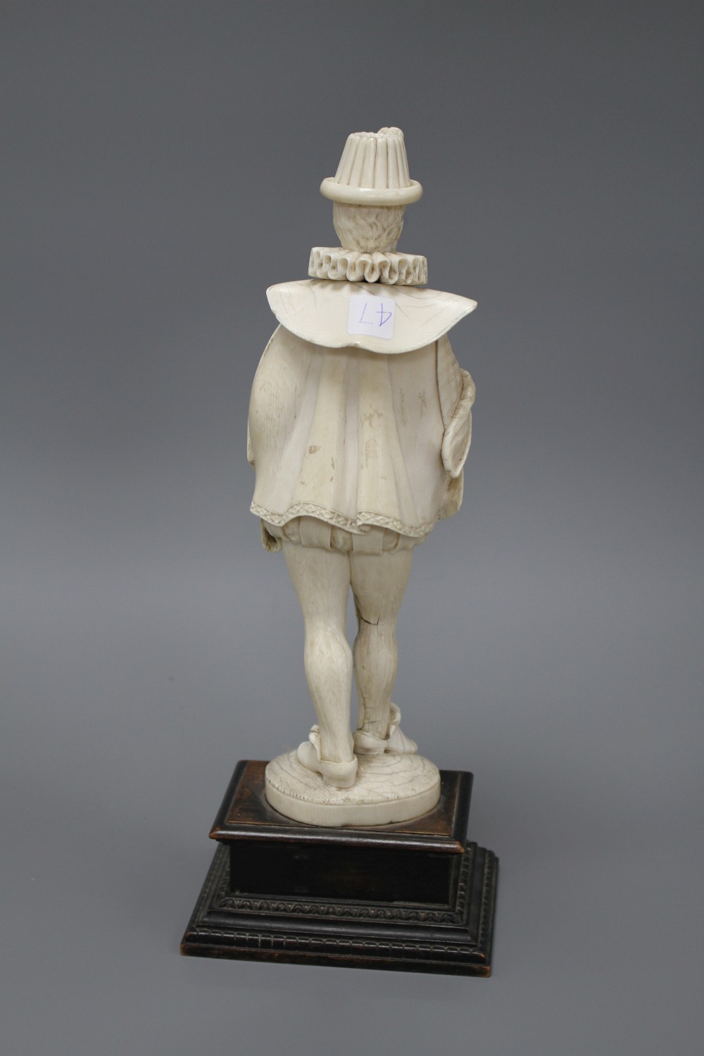 A 19th century Dieppe carved ivory figure of a 17th century gentleman, standing and wearing a ruff colour, height 30cm,